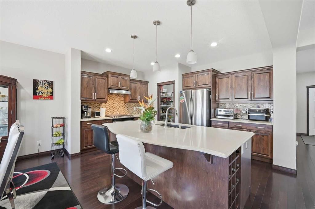 233 Aspenmere Circle, Chestermere, AB - Indoor Photo Showing Kitchen With Upgraded Kitchen