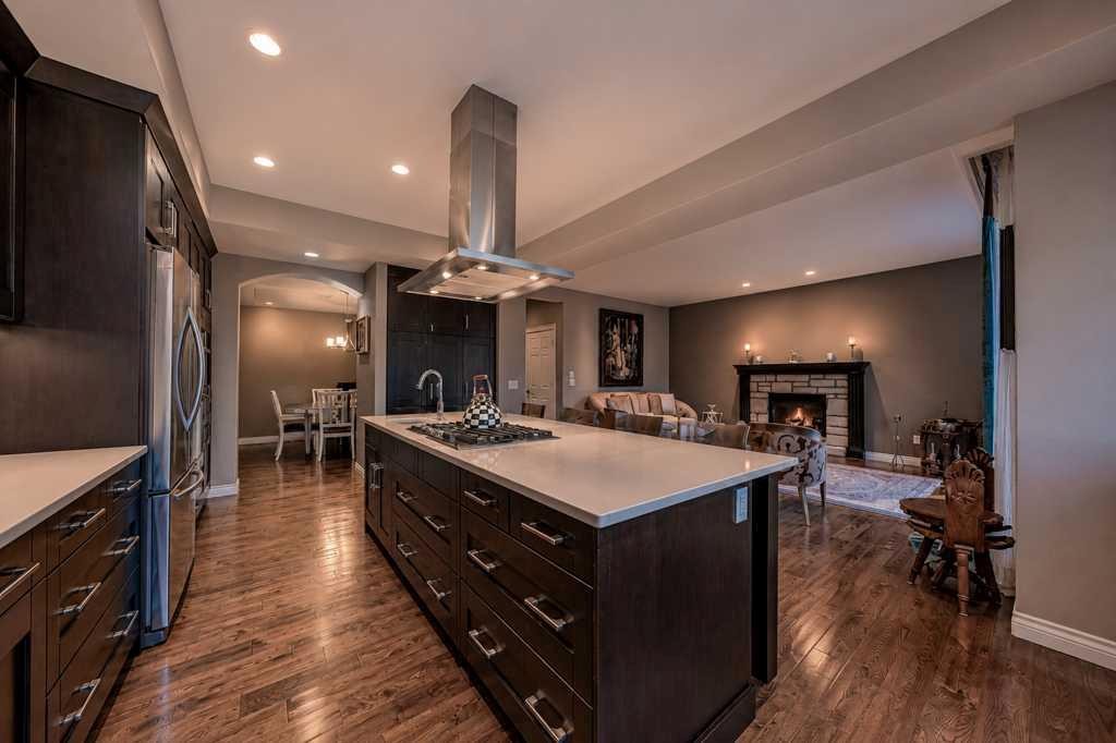 23 Aspen Summit Mount Sw, Calgary, AB - Indoor Photo Showing Kitchen With Fireplace