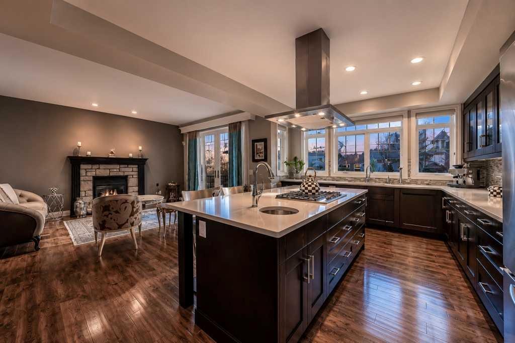 23 Aspen Summit Mount Sw, Calgary, AB - Indoor Photo Showing Kitchen With Fireplace