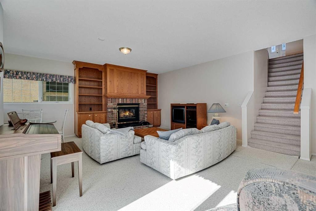 58 Evergreen Bay Sw, Calgary, AB - Indoor Photo Showing Living Room With Fireplace