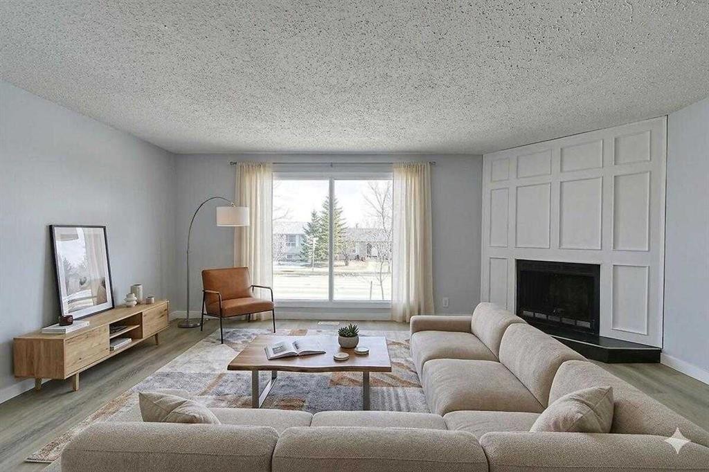 71 Falton Drive Ne, Calgary, AB - Indoor Photo Showing Living Room With Fireplace