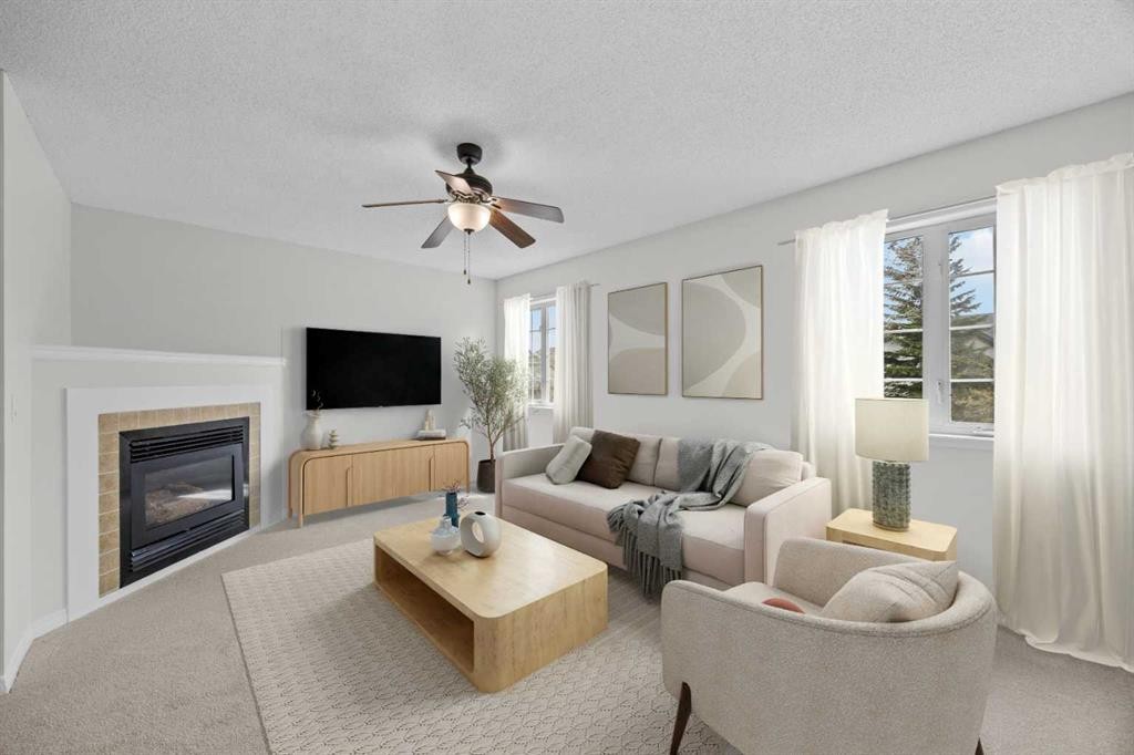 289 Hidden Spring Green Nw, Calgary, AB - Indoor Photo Showing Living Room With Fireplace