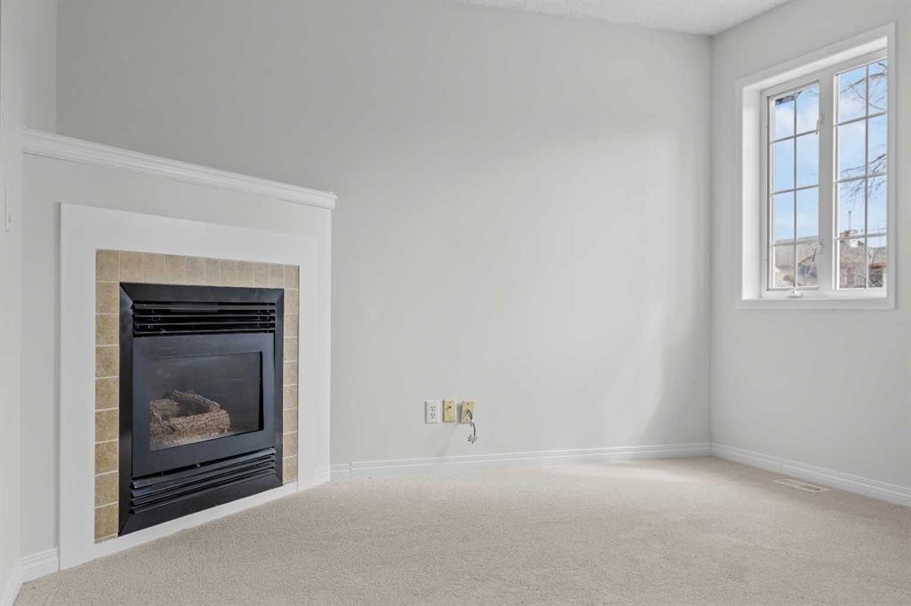 289 Hidden Spring Green Nw, Calgary, AB - Indoor With Fireplace
