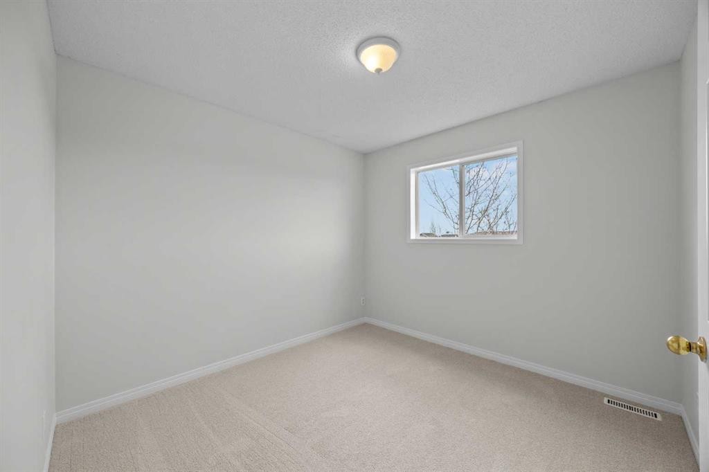 289 Hidden Spring Green Nw, Calgary, AB - Indoor Photo Showing Other Room