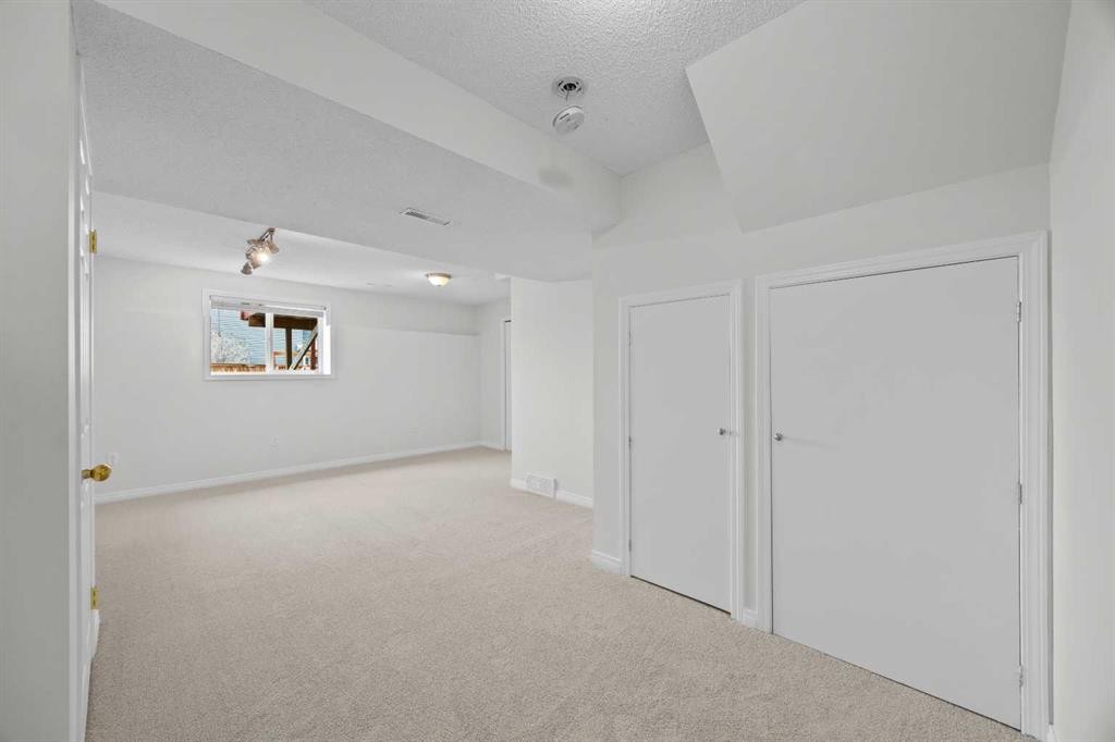 289 Hidden Spring Green Nw, Calgary, AB - Indoor Photo Showing Other Room
