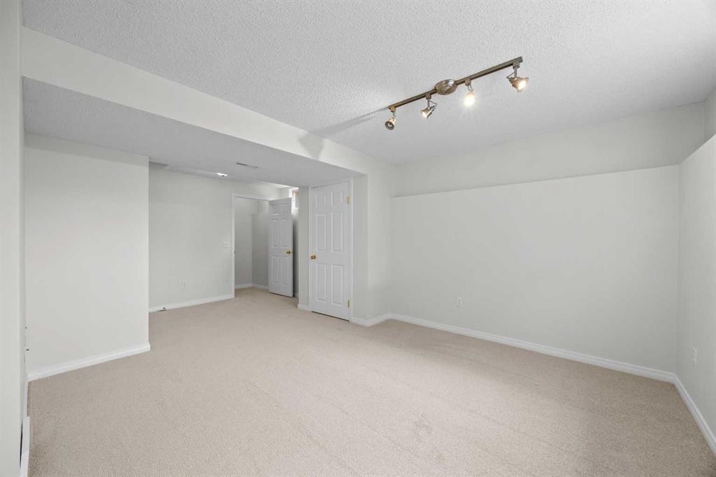 289 Hidden Spring Green Nw, Calgary, AB - Indoor Photo Showing Other Room