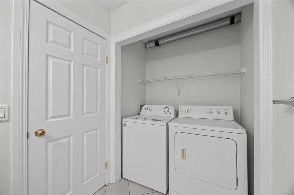 289 Hidden Spring Green Nw, Calgary, AB - Indoor Photo Showing Laundry Room