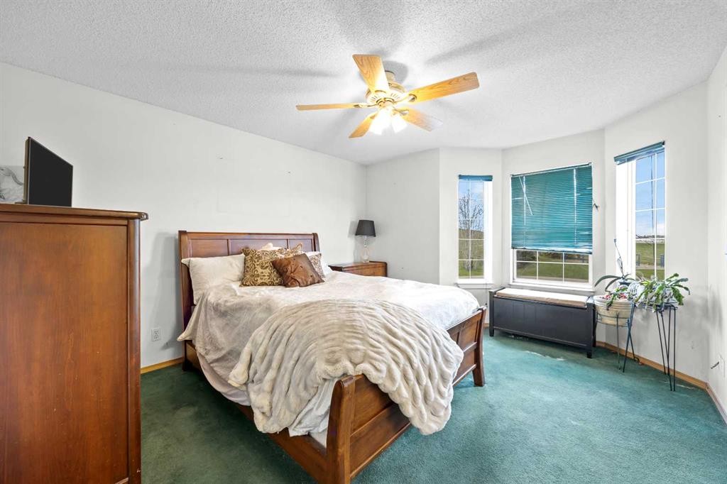 242 Hidden Spring Mews Nw, Calgary, AB - Indoor Photo Showing Bedroom