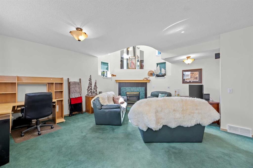 242 Hidden Spring Mews Nw, Calgary, AB - Indoor With Fireplace
