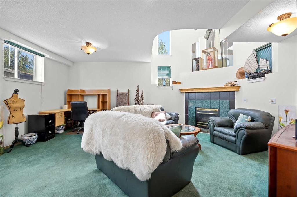 242 Hidden Spring Mews Nw, Calgary, AB - Indoor With Fireplace