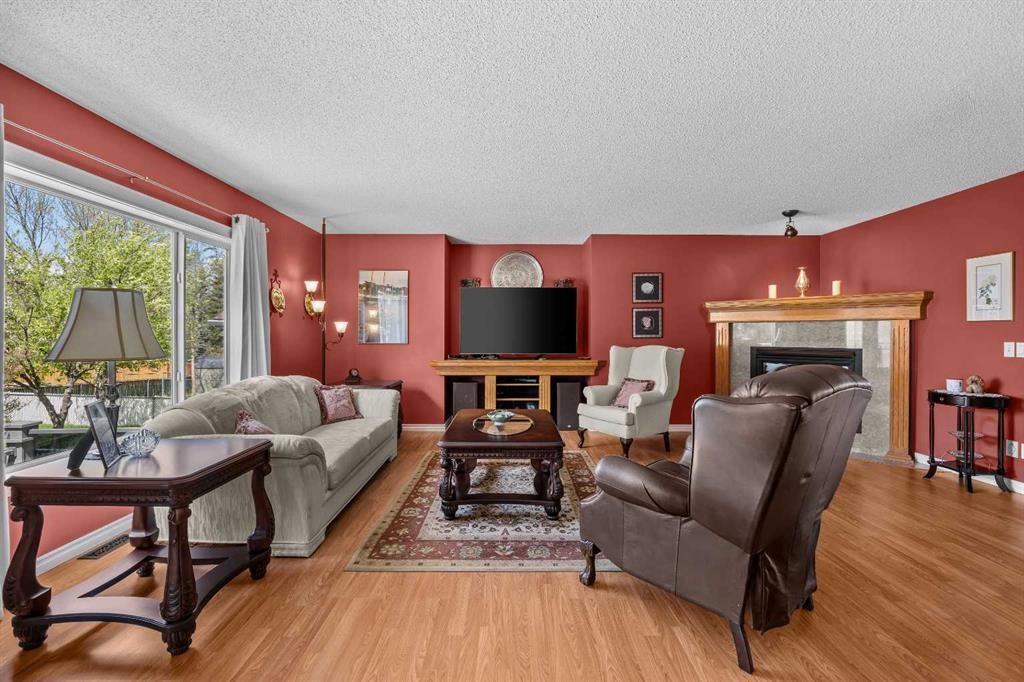 11178 Hidden Valley Drive Nw, Calgary, AB - Indoor Photo Showing Living Room With Fireplace