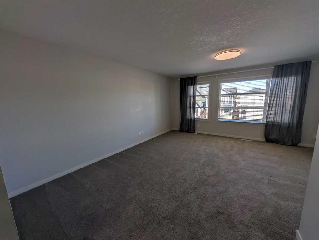 54 Seton Manor Se, Calgary, AB - Indoor Photo Showing Other Room