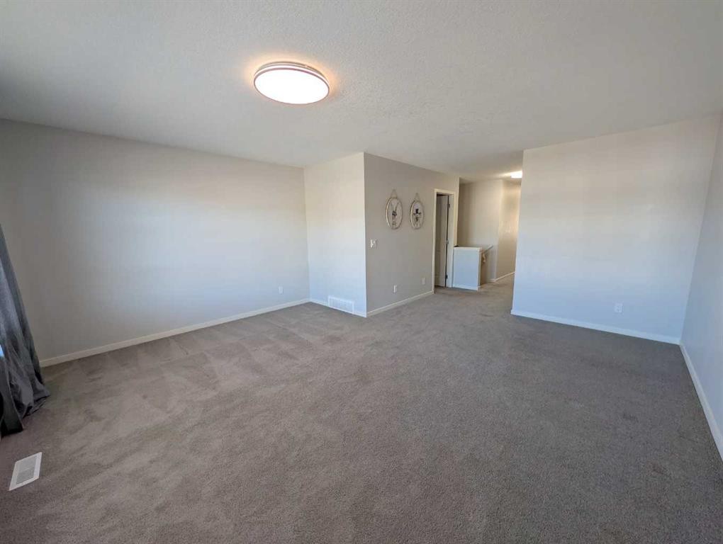 54 Seton Manor Se, Calgary, AB - Indoor Photo Showing Other Room