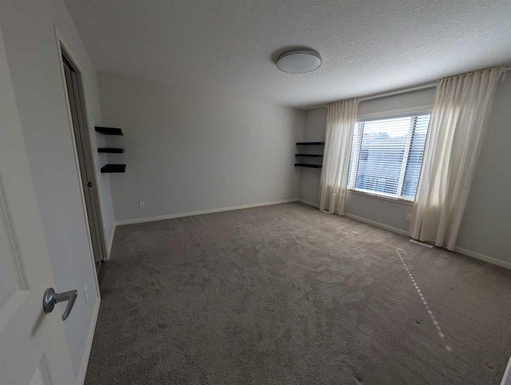 54 Seton Manor Se, Calgary, AB - Indoor Photo Showing Other Room