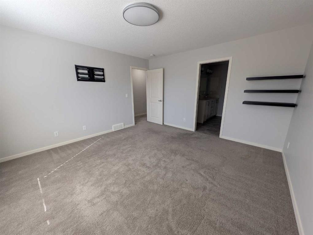 54 Seton Manor Se, Calgary, AB - Indoor Photo Showing Other Room