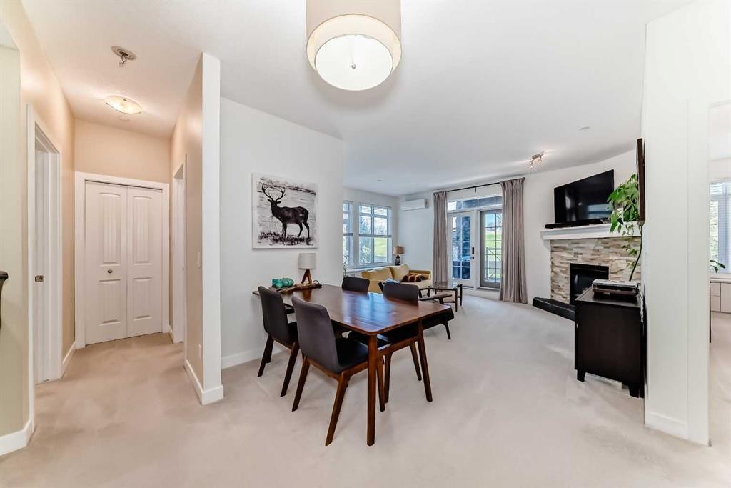 116-1005A Westmount Drive, Strathmore, AB - Indoor Photo Showing Dining Room With Fireplace
