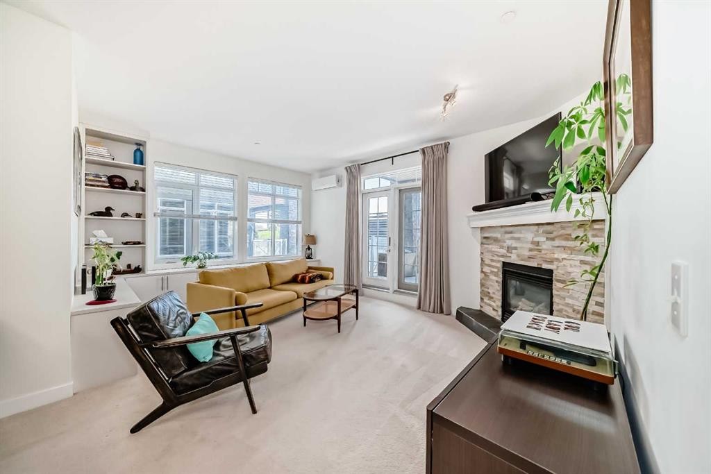 116-1005A Westmount Drive, Strathmore, AB - Indoor Photo Showing Living Room With Fireplace