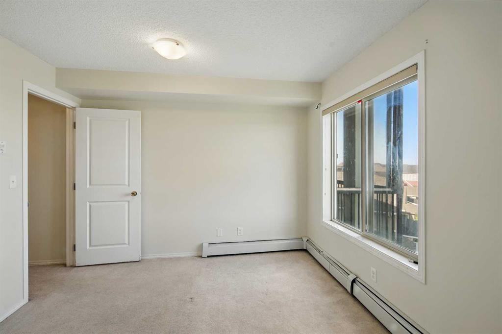 409-15 Saddlestone Way Ne, Calgary, AB - Indoor Photo Showing Other Room