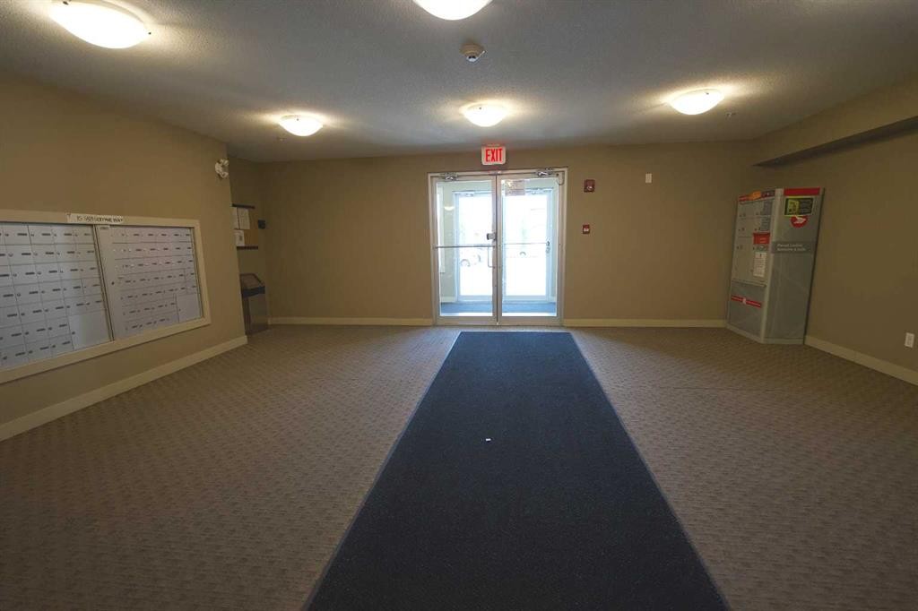 409-15 Saddlestone Way Ne, Calgary, AB - Indoor Photo Showing Other Room