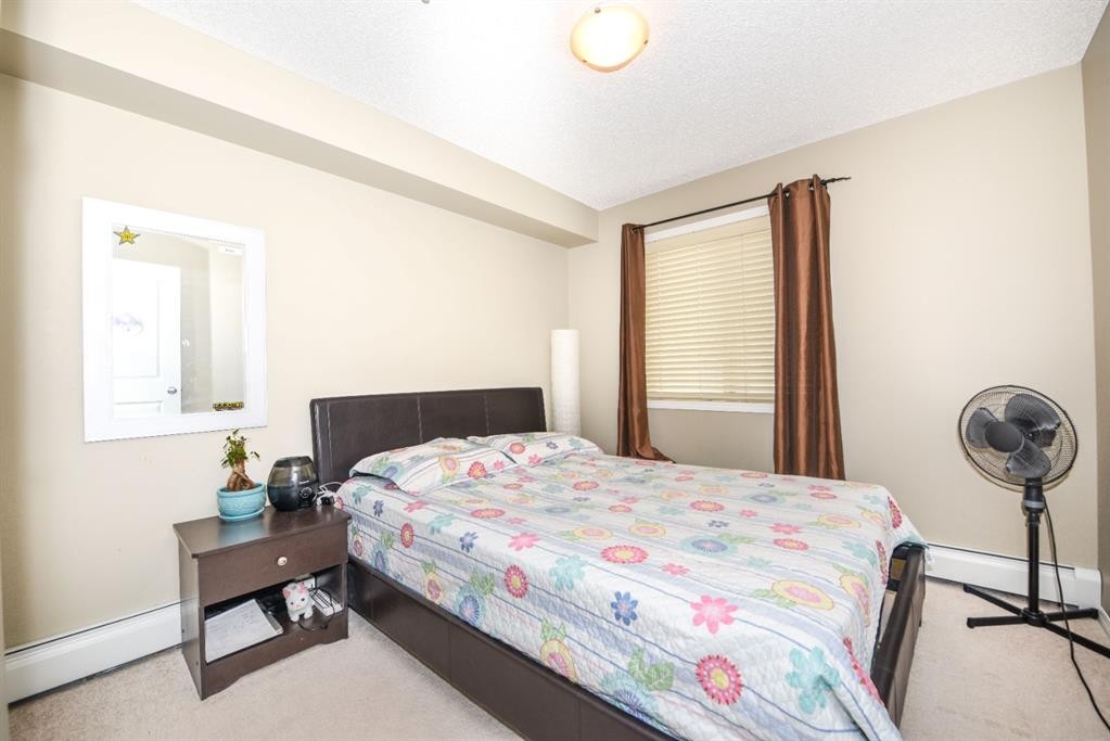 302-5 Saddlestone Way Ne, Calgary, AB - Indoor Photo Showing Bedroom