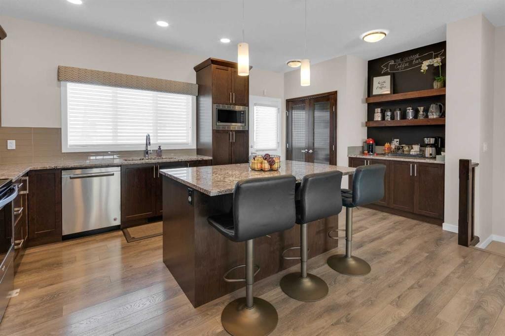 216 Sundown Road, Cochrane, AB - Indoor Photo Showing Kitchen With Upgraded Kitchen