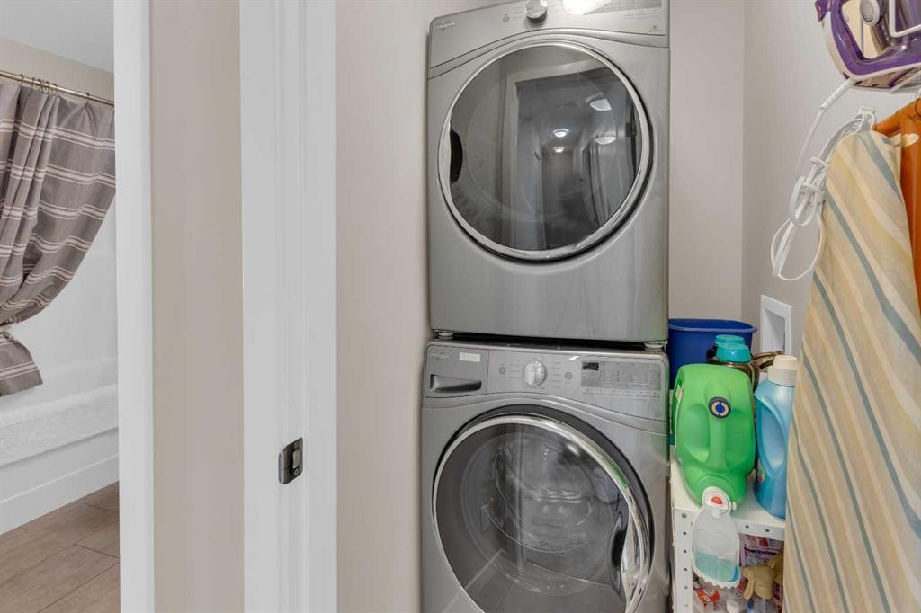 216 Sundown Road, Cochrane, AB - Indoor Photo Showing Laundry Room