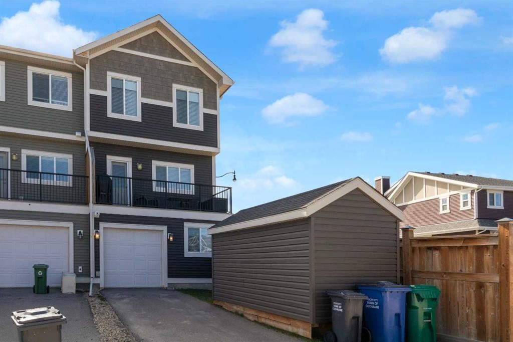 216 Sundown Road, Cochrane, AB - Outdoor With Facade