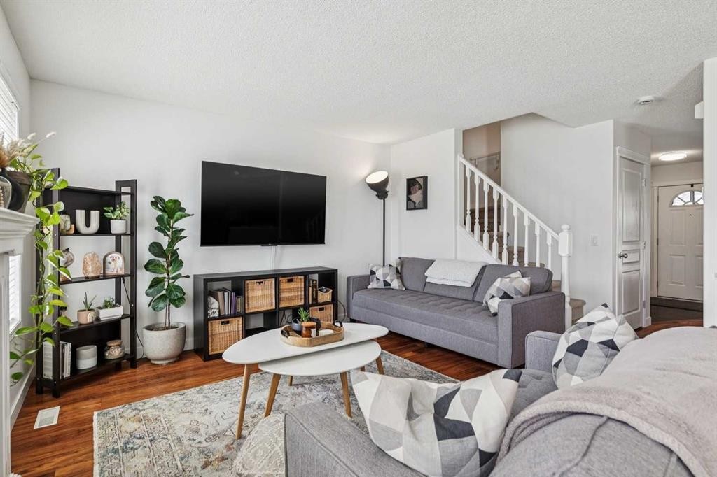94 West Springs Way Sw, Calgary, AB - Indoor Photo Showing Living Room