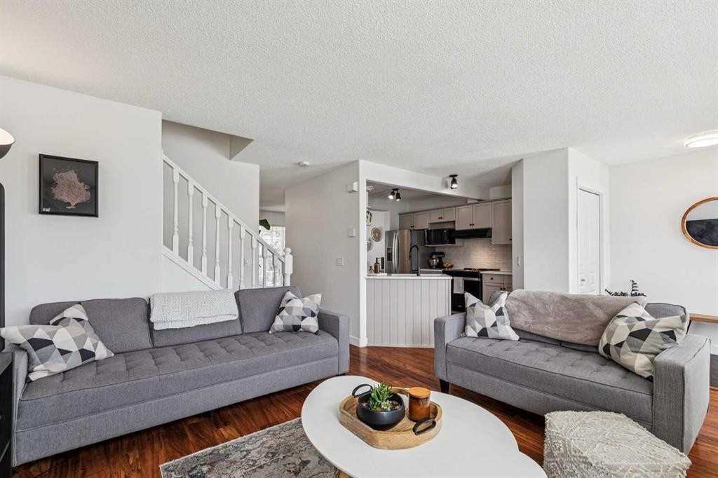 94 West Springs Way Sw, Calgary, AB - Indoor Photo Showing Living Room