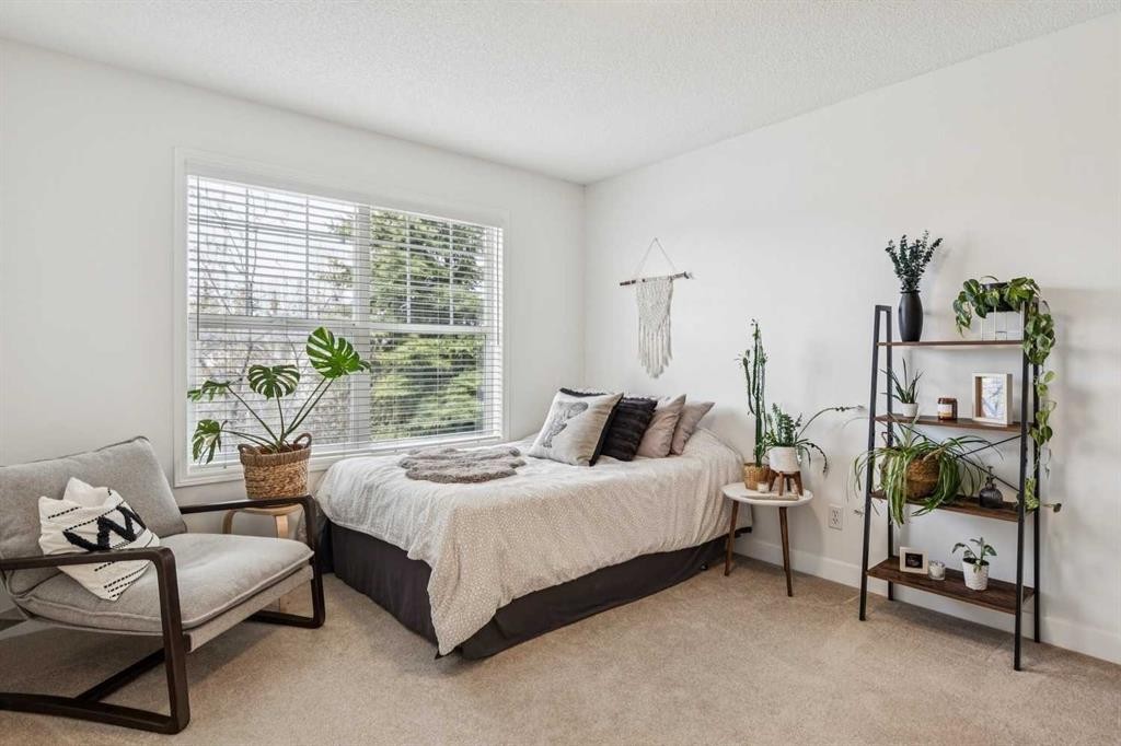 94 West Springs Way Sw, Calgary, AB - Indoor Photo Showing Bedroom