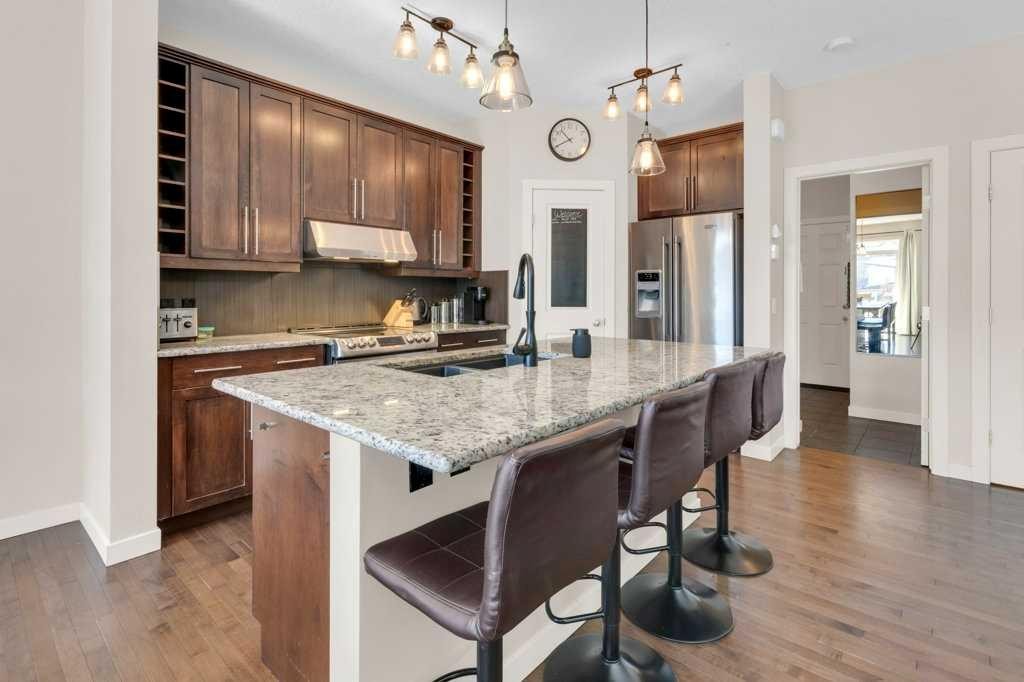 26 Heritage Landing, Cochrane, AB - Indoor Photo Showing Kitchen With Double Sink With Upgraded Kitchen