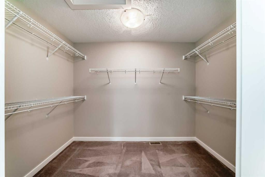 210 Stonemere Green, Chestermere, AB - Indoor With Storage