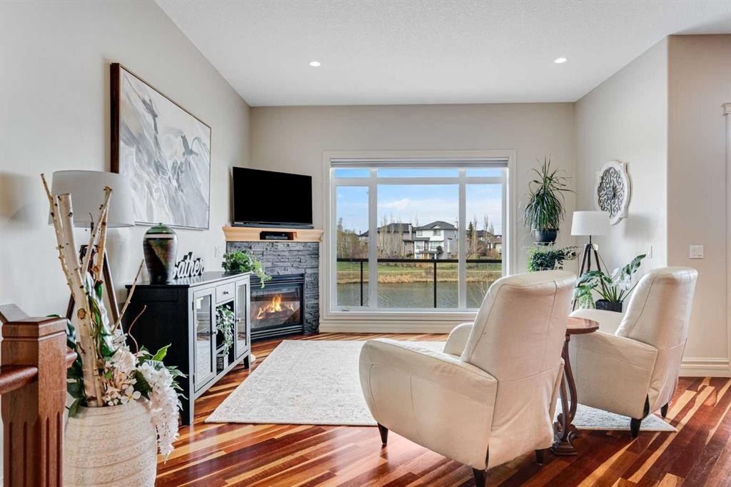 168 West Creek Landing, Chestermere, AB - Indoor Photo Showing Living Room With Fireplace