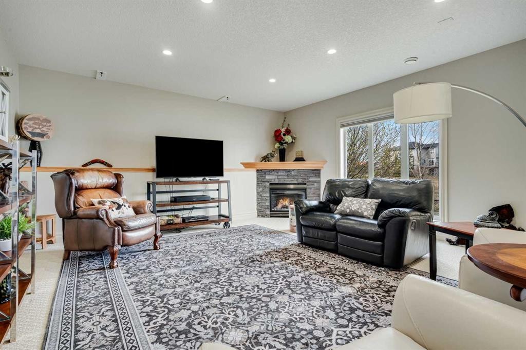 168 West Creek Landing, Chestermere, AB - Indoor Photo Showing Living Room With Fireplace