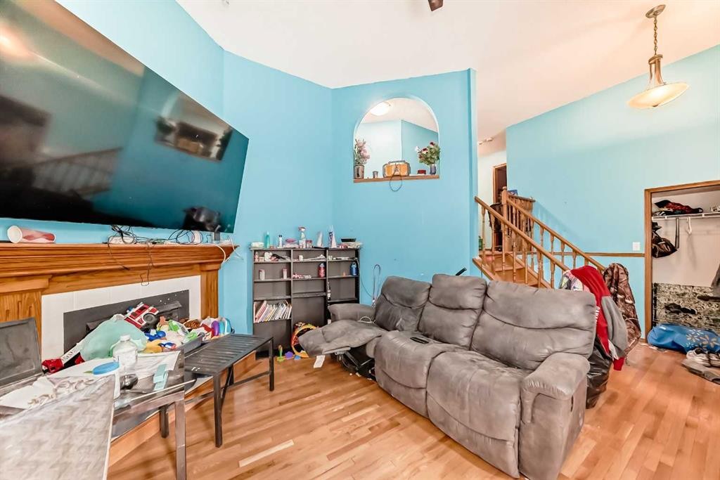 176 Woodside Road Nw, Airdrie, AB - Indoor Photo Showing Living Room With Fireplace