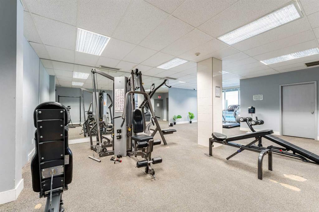 802-4944 Dalton Drive Nw, Calgary, AB - Indoor Photo Showing Gym Room