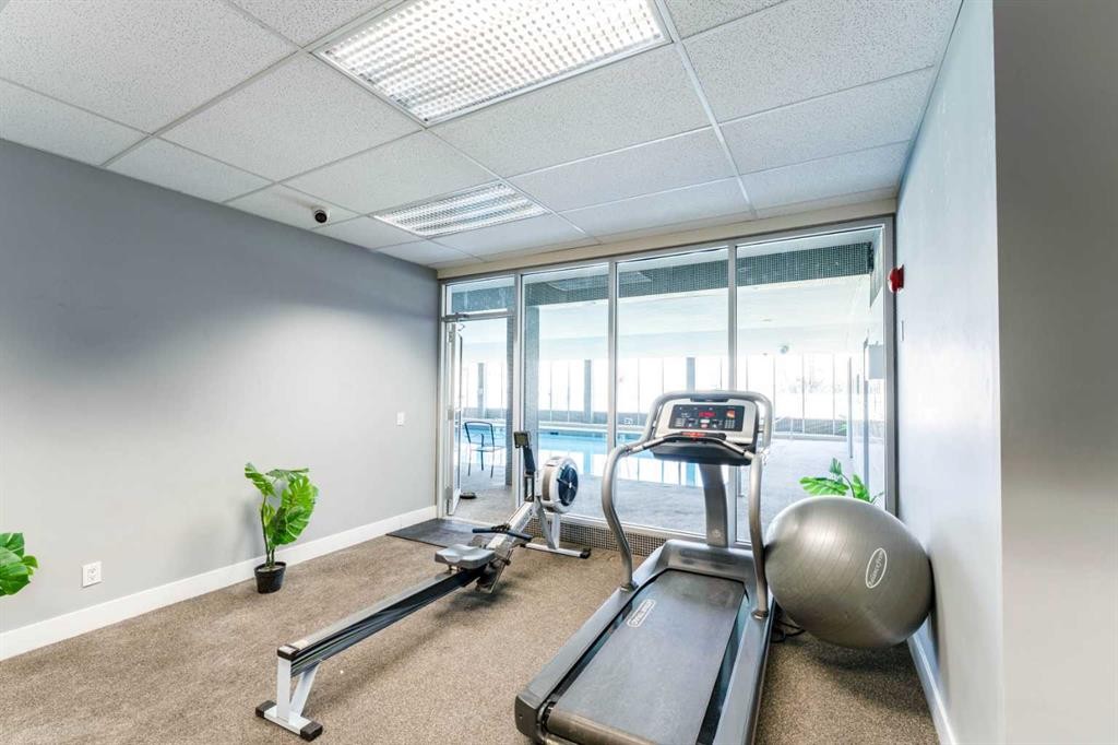 802-4944 Dalton Drive Nw, Calgary, AB - Indoor Photo Showing Gym Room
