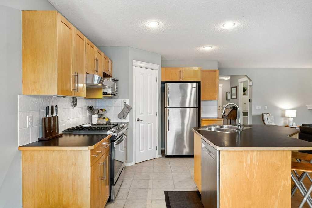90 Elgin Drive Se, Calgary, AB - Indoor Photo Showing Kitchen With Stainless Steel Kitchen With Double Sink