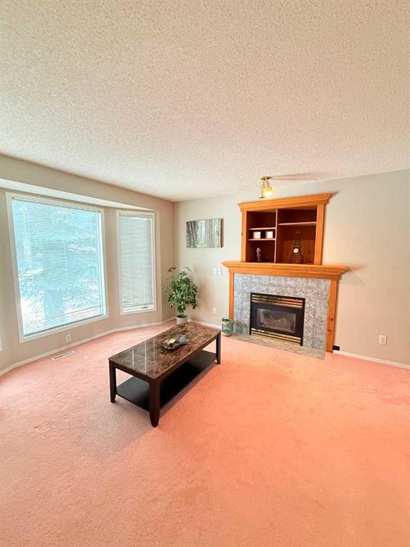 7212 Sierra Morena Boulevard Sw, Calgary, AB - Indoor Photo Showing Living Room With Fireplace