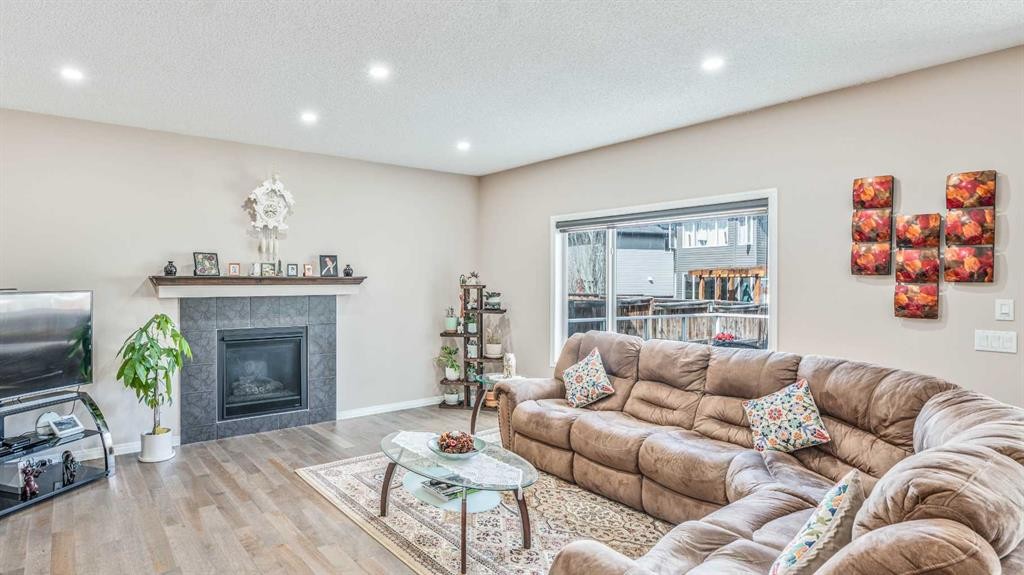 14 Silverado Ridge Link Sw, Calgary, AB - Indoor Photo Showing Living Room With Fireplace