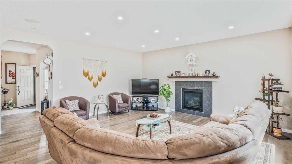 14 Silverado Ridge Link Sw, Calgary, AB - Indoor Photo Showing Living Room With Fireplace
