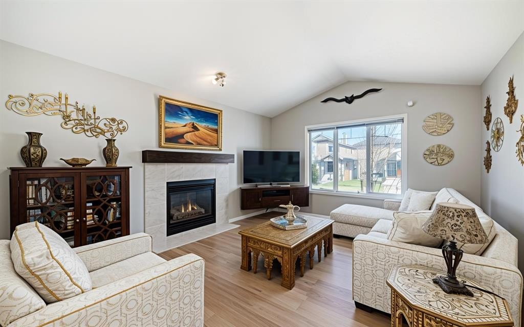 231 Saddlebrook Way Ne, Calgary, AB - Indoor Photo Showing Living Room With Fireplace