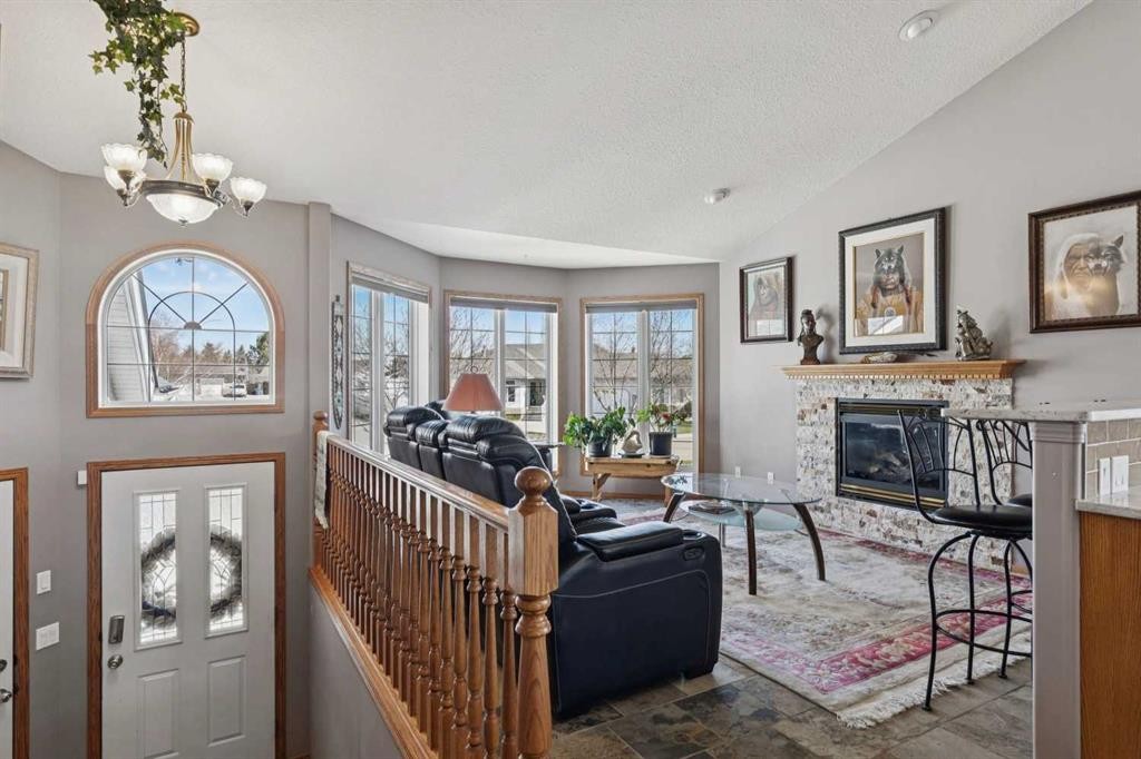 28 Westpoint Drive, Didsbury, AB - Indoor Photo Showing Living Room With Fireplace