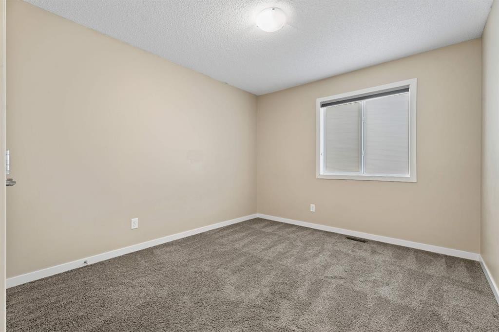 30 Redstone Parade Ne, Calgary, AB - Indoor Photo Showing Other Room