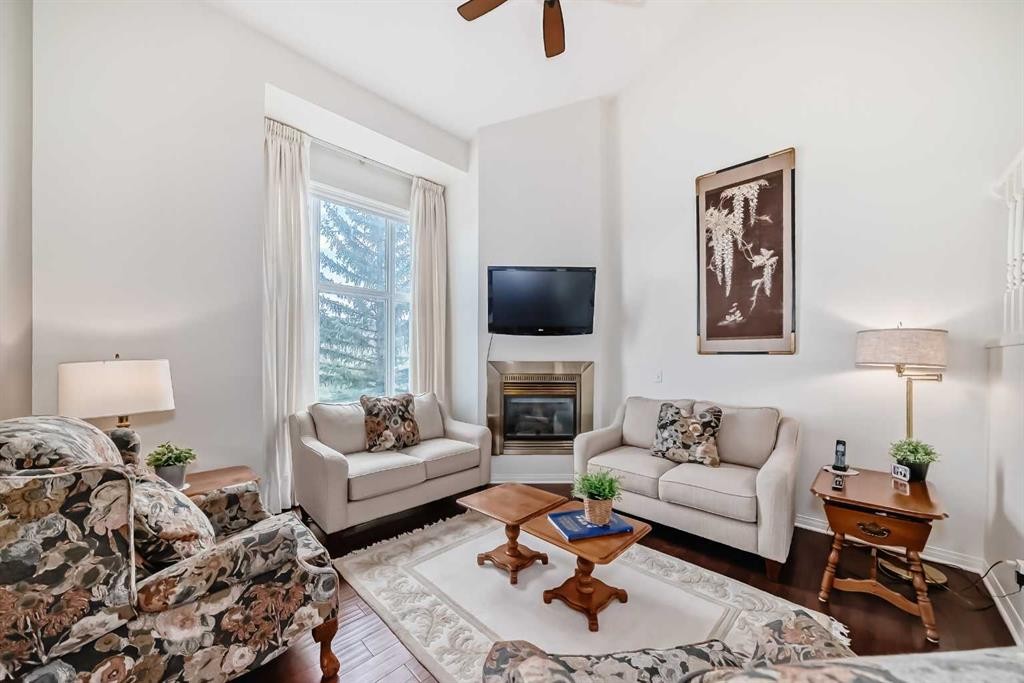 305 Sandringham Road Nw, Calgary, AB - Indoor Photo Showing Living Room With Fireplace