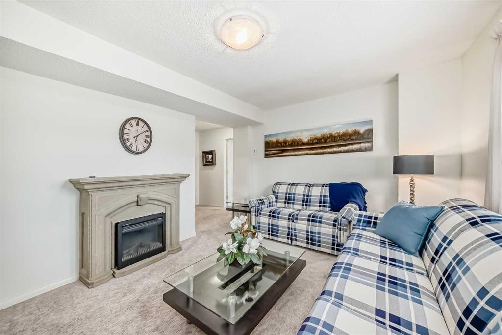 305 Sandringham Road Nw, Calgary, AB - Indoor Photo Showing Living Room With Fireplace