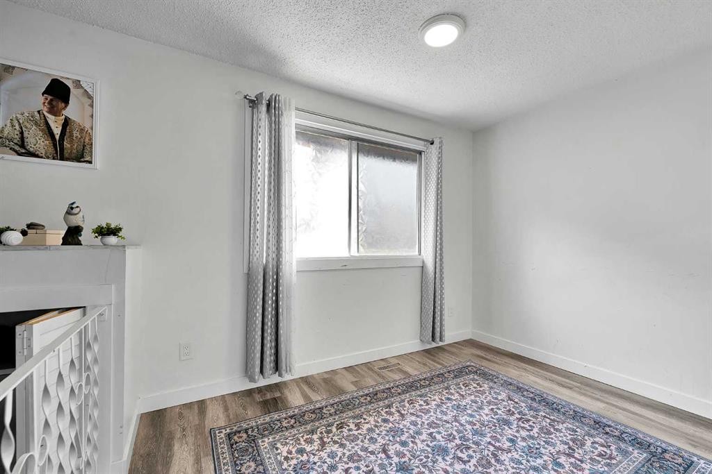 3-4543 7 Avenue Se, Calgary, AB - Indoor Photo Showing Other Room With Fireplace