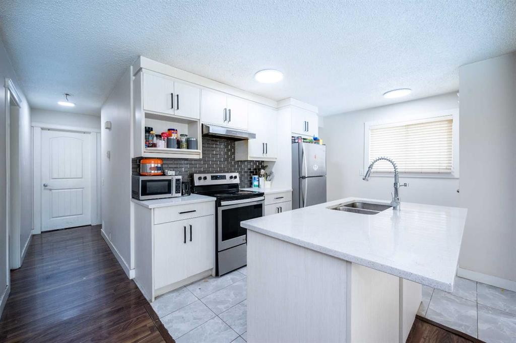 72 Faldale Close Ne, Calgary, AB - Indoor Photo Showing Kitchen With Stainless Steel Kitchen With Double Sink