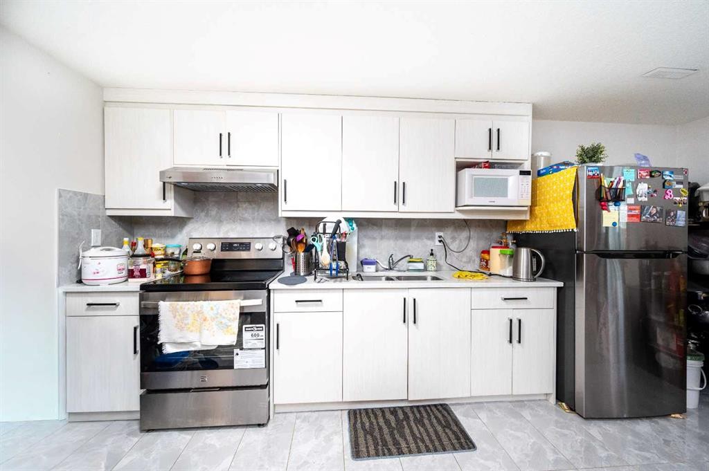 72 Faldale Close Ne, Calgary, AB - Indoor Photo Showing Kitchen With Double Sink