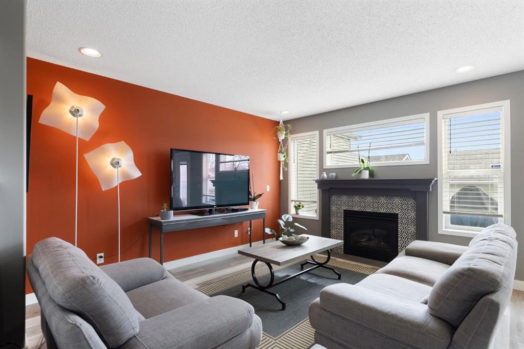 18 West Springs Gate Sw, Calgary, AB - Indoor Photo Showing Living Room With Fireplace